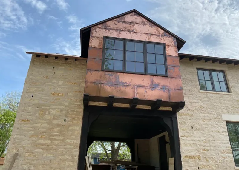 Copper metal panel facade on a stone building for Skylight Installation in Helena-West Helena