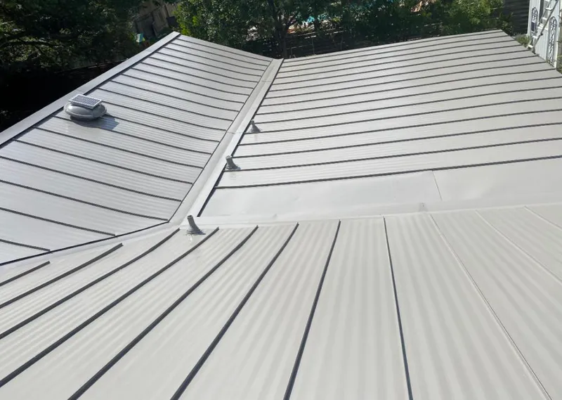 Solar attic fan installed on a metal roof for Roof Ventilation in Helena-West Helena
